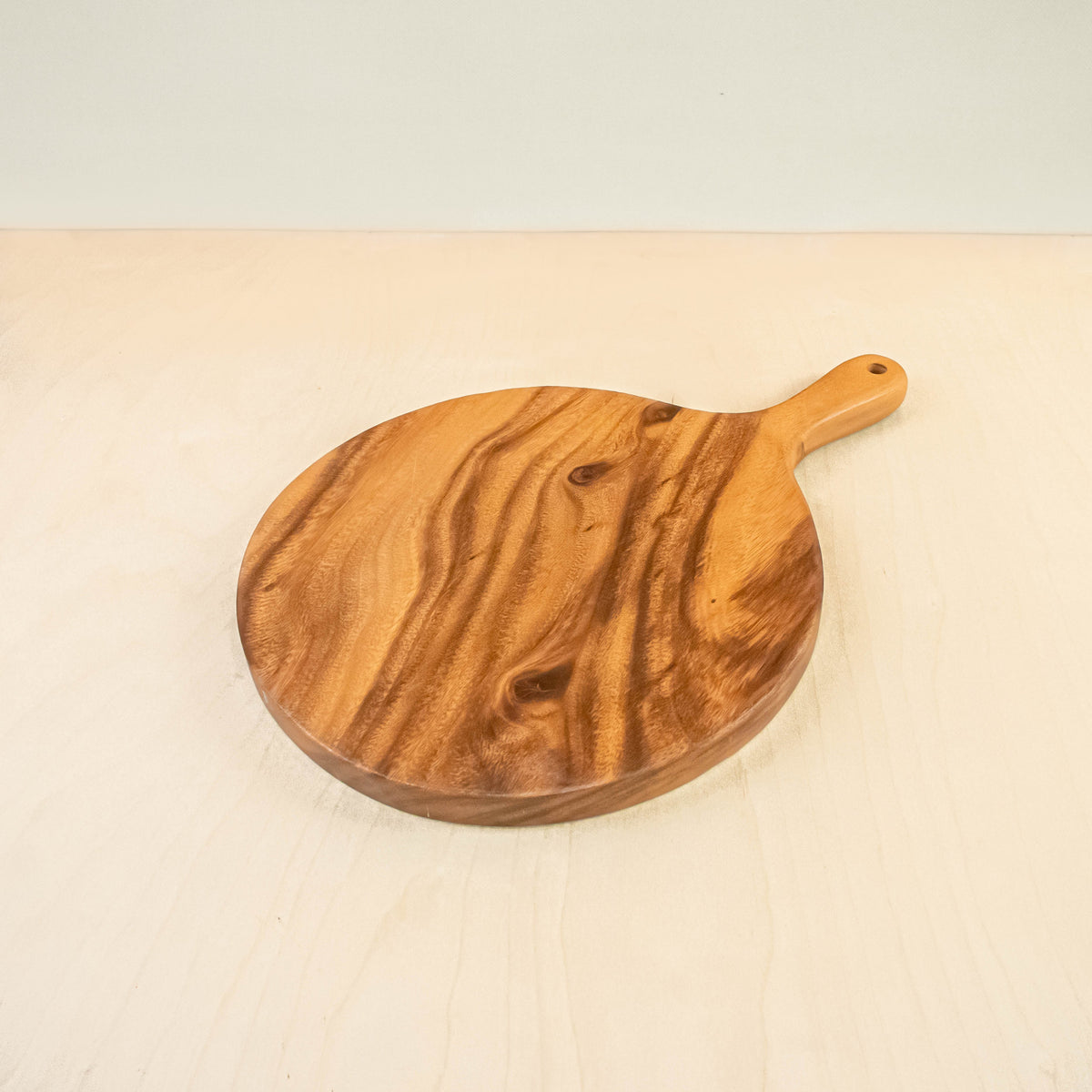 Routine Ready Acacia Cutting Board - Round with handle for daily home and personal routines with general everyday essentials